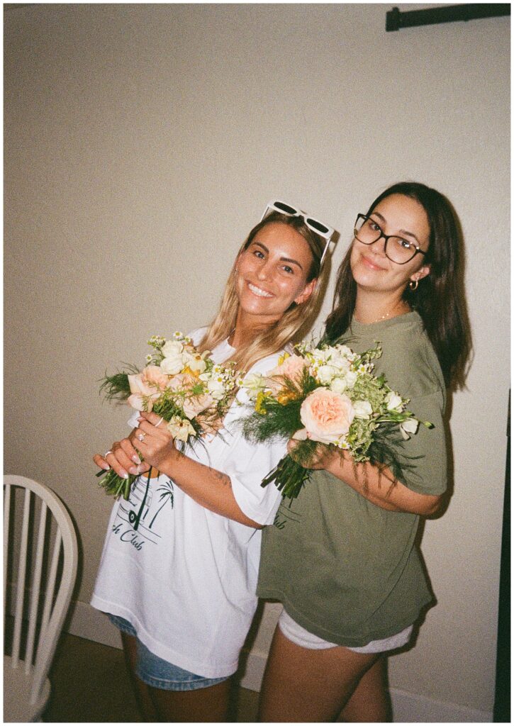 Bridal party enjoying diy flower bar to make bouquets for wedding during the wedding weekend celebration