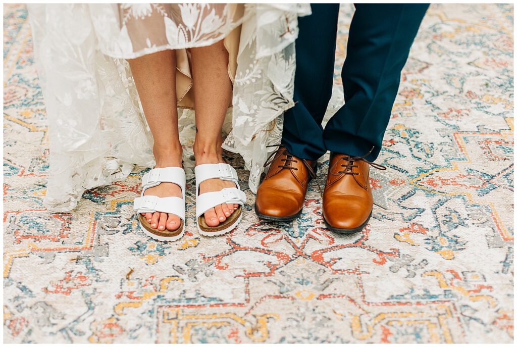 Bride Kali wearing white Birkenstock sandals at Wildflower Farm wedding in Friendsville, Tennessee